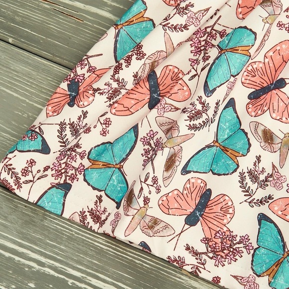 Long sleeved butterfly print tunic top with solid color blue fitted bottoms - Picture 2 of 9